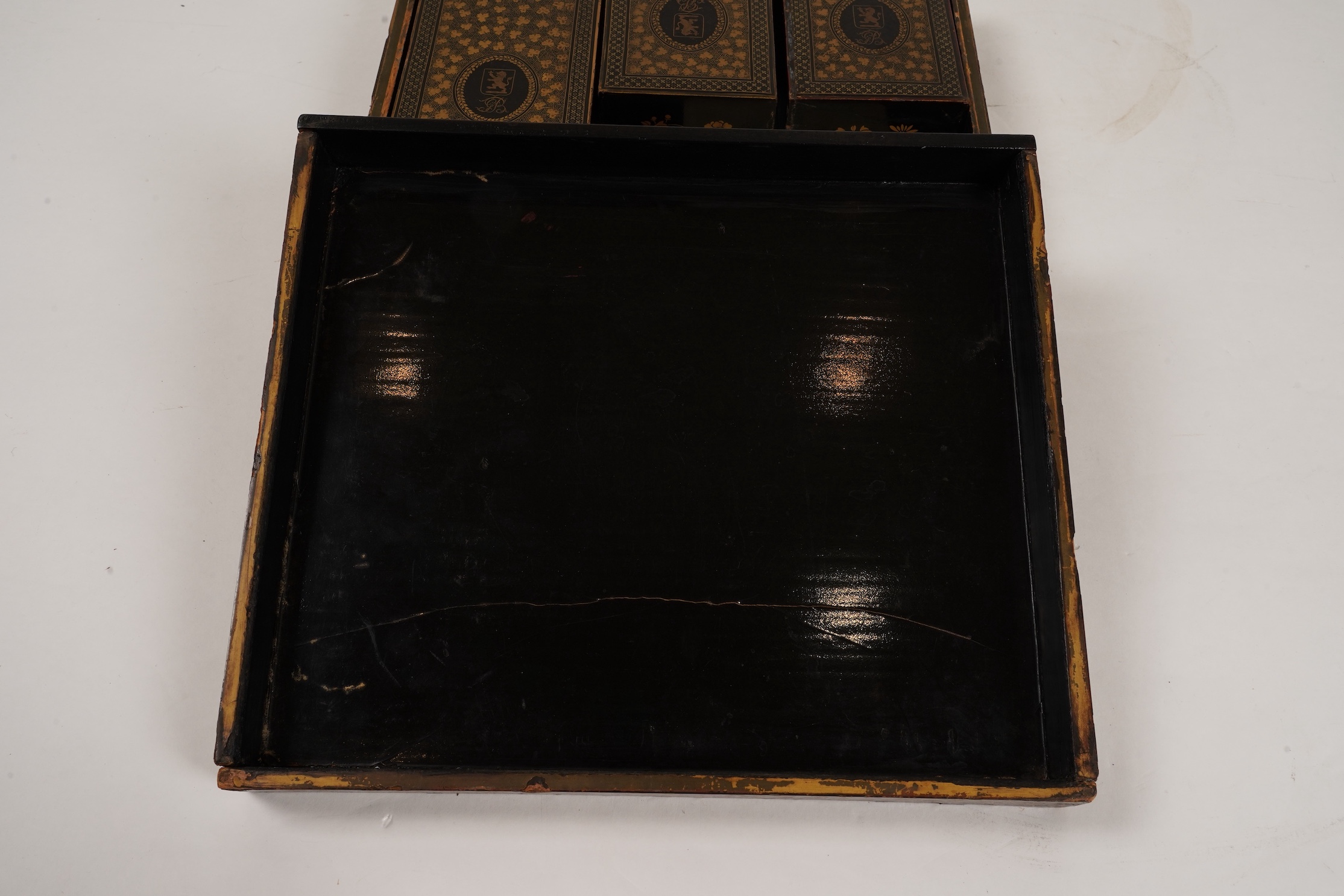Two Chinese gilt decorated black lacquer games boxes, containing numerous mother-of-pearl counters, 19th century